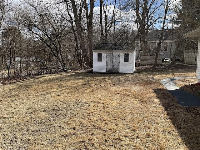 view of yard featuring an outbuilding and a shed