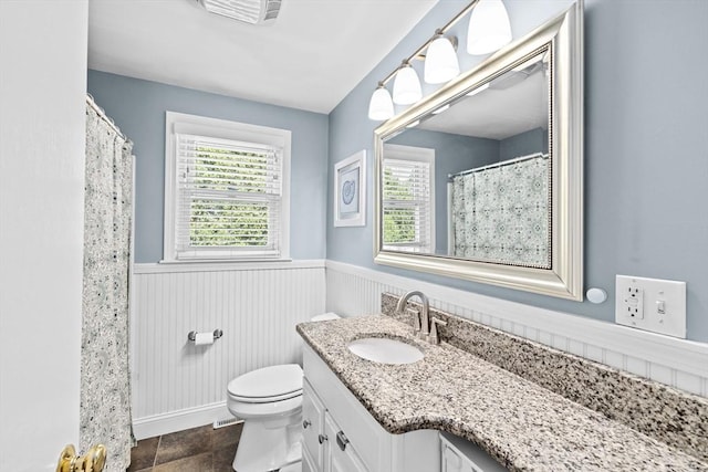 58 Spring St, Weymouth, MA 02188 - bathroom featuring a wainscoted wall, plenty of natural light, vanity, toilet, and curtained shower