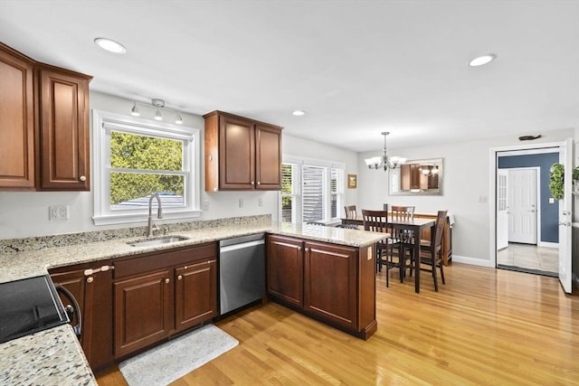 58 Spring St, Weymouth, MA 02188 - kitchen with dishwasher, a sink, light wood-style flooring, range, and a peninsula