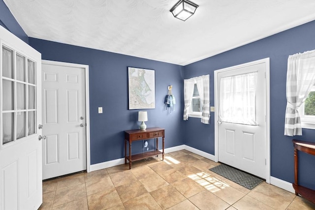 58 Spring St, Weymouth, MA 02188 - foyer entrance featuring baseboards