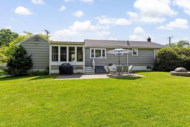 58 Spring St, Weymouth, MA 02188 - rear view of house featuring a patio, a lawn, entry steps, and a chimney