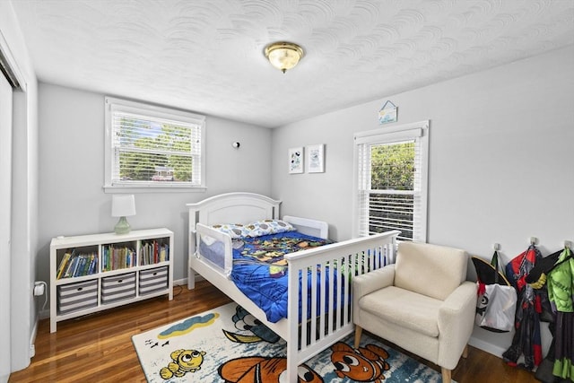 58 Spring St, Weymouth, MA 02188 - bedroom with wood finished floors and baseboards
