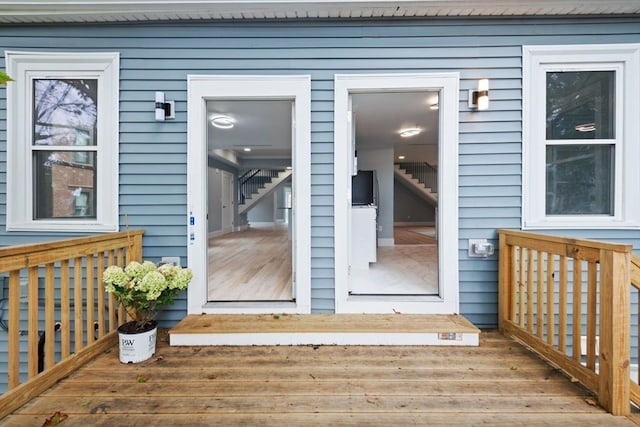 doorway to property featuring a wooden deck