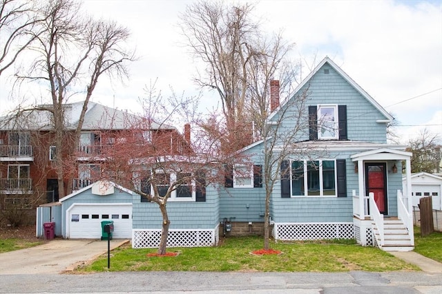 view of front of home with a garage, a chimney, concrete driveway, and a front yard