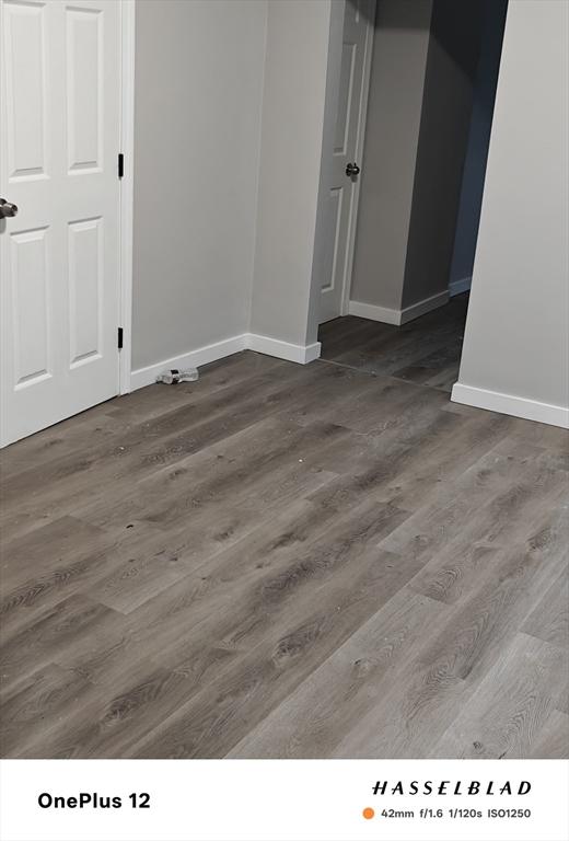 54 Shirley Ave, Revere, MA 02151 - unfurnished room featuring baseboards and wood finished floors