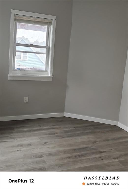 54 Shirley Ave, Revere, MA 02151 - spare room featuring wood finished floors and baseboards