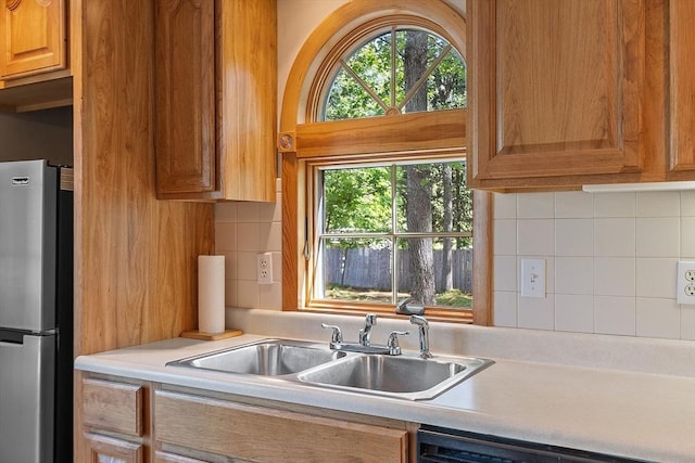 15 Moore Rd, Westford, MA 01886 - kitchen with freestanding refrigerator, a sink, light countertops, and backsplash