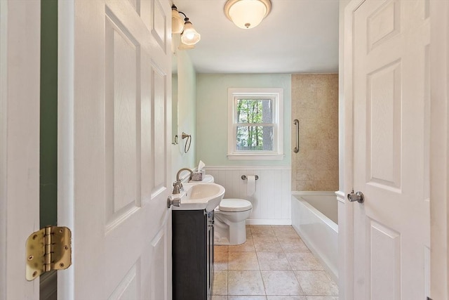 15 Moore Rd, Westford, MA 01886 - bathroom with toilet, vanity, tile patterned floors, and a decorative wall