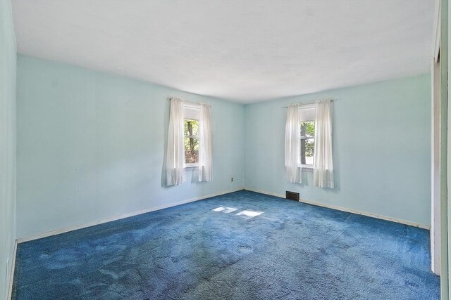 15 Moore Rd, Westford, MA 01886 - carpeted spare room with healthy amount of natural light and baseboards
