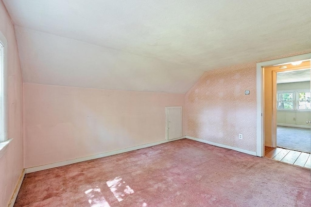 15 Moore Rd, Westford, MA 01886 - bonus room with lofted ceiling, carpet flooring, and baseboards