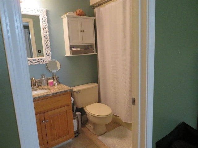 155 Kendrick Ave Unit 306, Quincy, MA 02169 - full bath featuring toilet, vanity, tile patterned flooring, and curtained shower