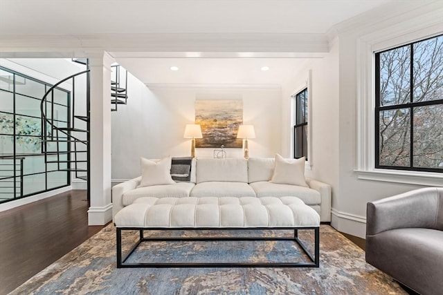 living room featuring crown molding, hardwood / wood-style flooring, and decorative columns