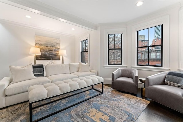 living room with beam ceiling, crown molding, and dark hardwood / wood-style flooring