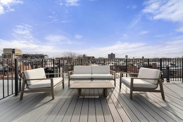 wooden terrace with outdoor lounge area