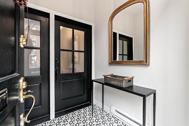 doorway with a baseboard heating unit