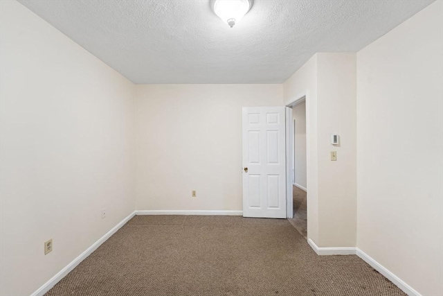 200 Manville Hill Rd Unit B-28, Cumberland, RI 02864 - carpeted empty room with a textured ceiling and baseboards