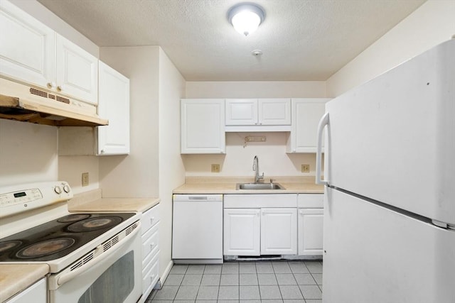 200 Manville Hill Rd Unit B-28, Cumberland, RI 02864 - kitchen featuring white appliances, a sink, white cabinets, light tile patterned floors, and light countertops