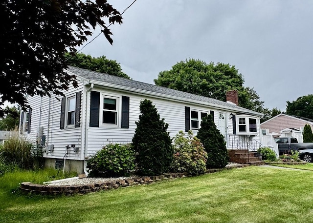 43 Shirley Ave, Methuen, MA 01844 - view of front of house featuring a chimney and a front yard