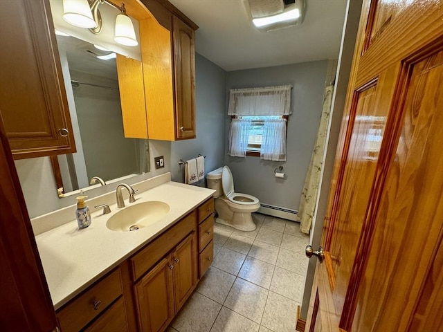 43 Shirley Ave, Methuen, MA 01844 - bathroom with baseboard heating, vanity, and tile patterned floors