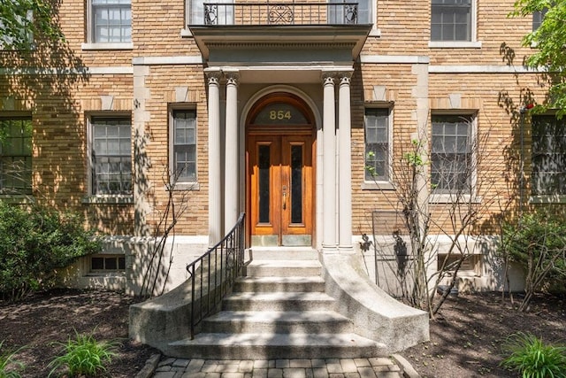 854 Massachusetts Ave Unit 11, Cambridge, MA 02139 - doorway to property with a balcony and brick siding