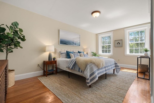 854 Massachusetts Ave Unit 11, Cambridge, MA 02139 - bedroom with baseboards and light wood-style floors