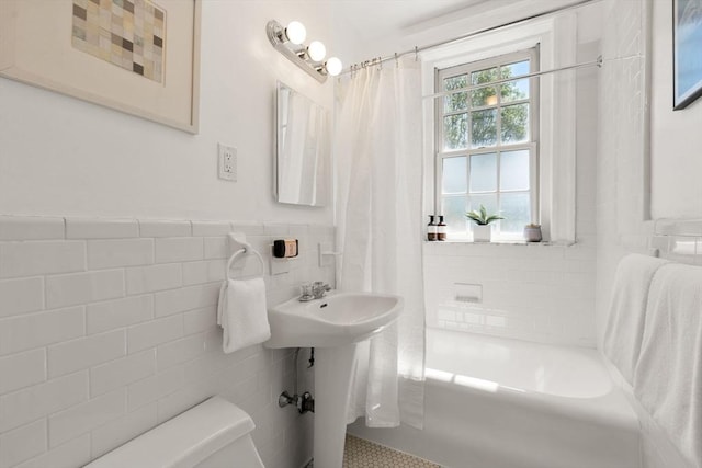854 Massachusetts Ave Unit 11, Cambridge, MA 02139 - bathroom with tile walls, toilet, wainscoting, and shower / bathtub combination with curtain