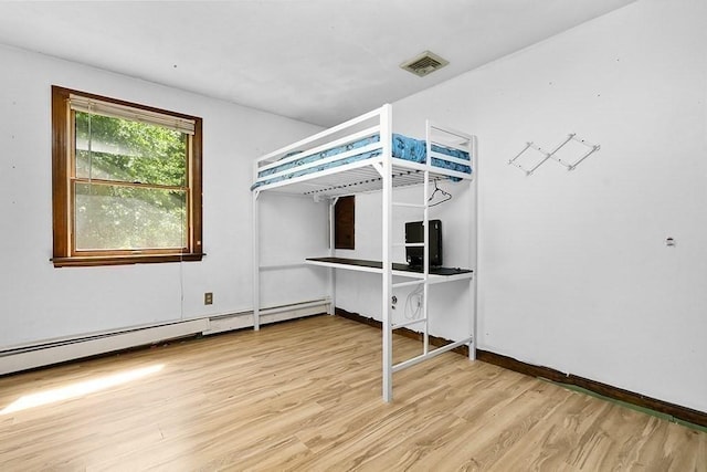 163 Walnut Rd, Wrentham, MA 02093 - unfurnished bedroom featuring wood finished floors, a baseboard radiator, and baseboards