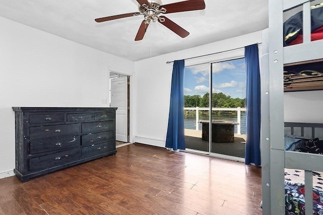 163 Walnut Rd, Wrentham, MA 02093 - unfurnished bedroom featuring access to outside, dark wood-style floors, a baseboard heating unit, and a ceiling fan