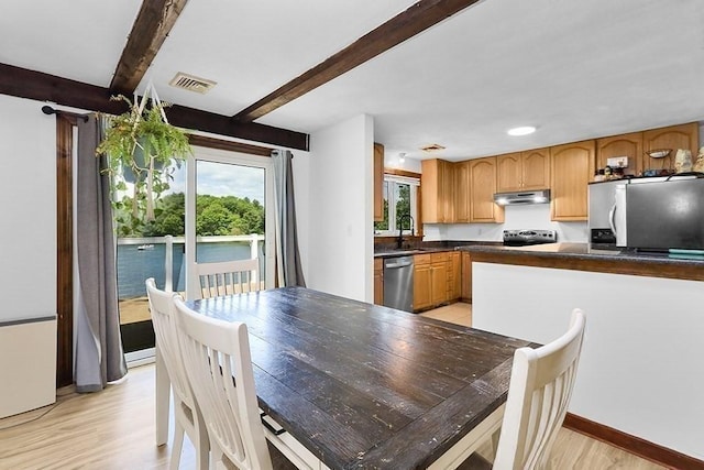 163 Walnut Rd, Wrentham, MA 02093 - dining area with beamed ceiling, light wood-style floors, and baseboards