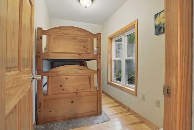 entryway featuring light wood-style floors and baseboards