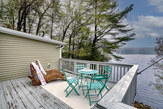 wooden deck with a water view