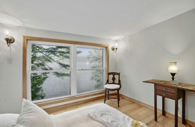 sitting room with light wood-style floors and baseboards