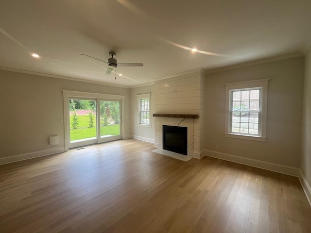 255 Old Main Rd Unit 2A, Falmouth, MA 02556 - unfurnished living room featuring ornamental molding, wood finished floors, a high end fireplace, ceiling fan, and recessed lighting