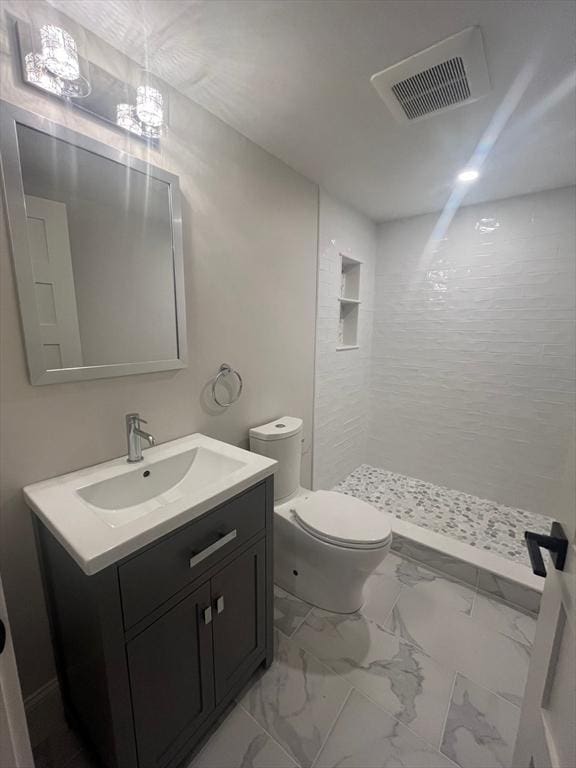 255 Old Main Rd Unit 2A, Falmouth, MA 02556 - full bathroom featuring a stall shower, vanity, and marble finish floors