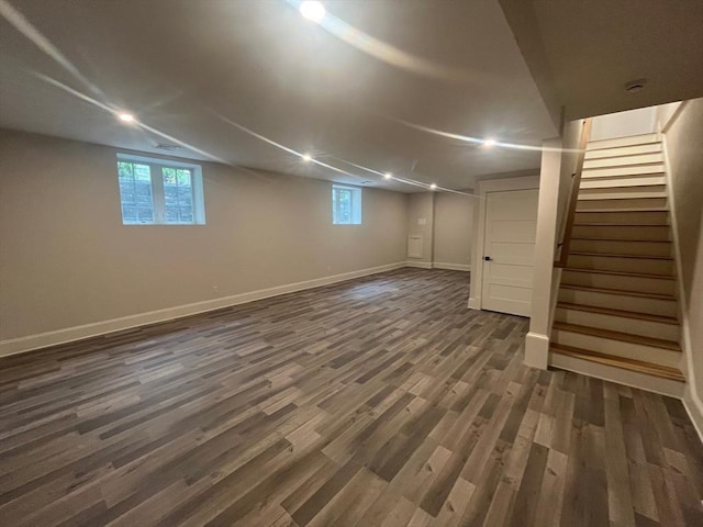 255 Old Main Rd Unit 2A, Falmouth, MA 02556 - basement with dark wood finished floors, stairway, and plenty of natural light