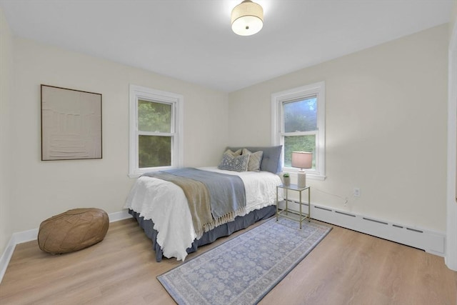 195 Pompeo Rd, Thompson, CT 06255 - bedroom featuring baseboard heating and wood finished floors