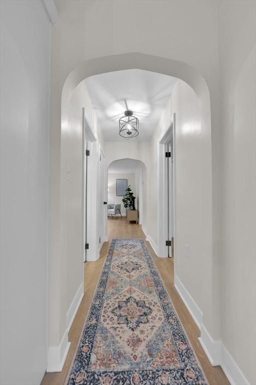 195 Pompeo Rd, Thompson, CT 06255 - hallway with arched walkways and light wood-type flooring