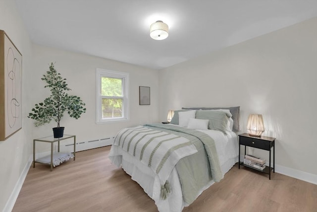 195 Pompeo Rd, Thompson, CT 06255 - bedroom with a baseboard radiator and light wood-type flooring
