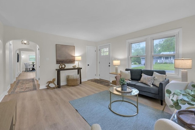 195 Pompeo Rd, Thompson, CT 06255 - living area featuring arched walkways and wood finished floors