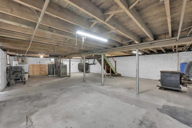 195 Pompeo Rd, Thompson, CT 06255 - unfinished basement featuring heating fuel, water heater, and stairway