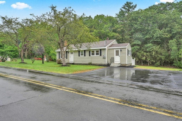 195 Pompeo Rd, Thompson, CT 06255 - view of front facade with entry steps, driveway, a chimney, and a front yard