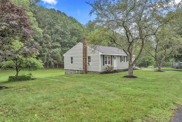 195 Pompeo Rd, Thompson, CT 06255 - view of property exterior with a lawn and a chimney