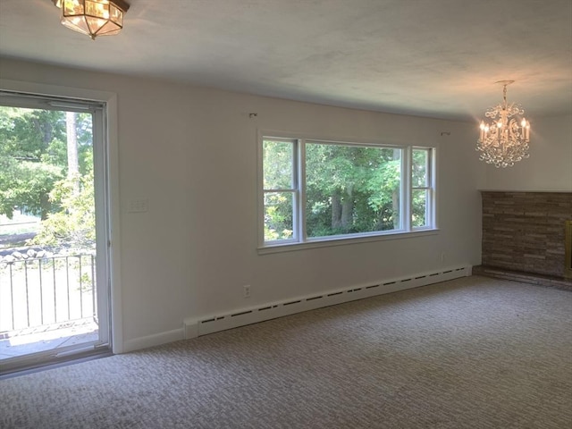 carpeted empty room with baseboards, baseboard heating, and an inviting chandelier