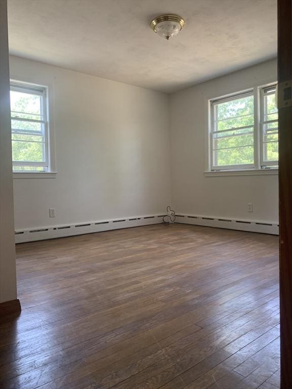 spare room with dark wood finished floors