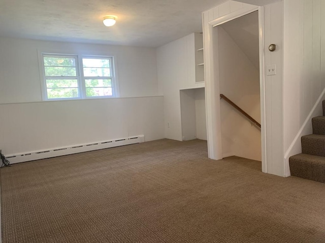 interior space featuring baseboard heating and carpet