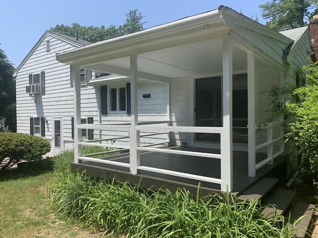 rear view of house featuring a chimney