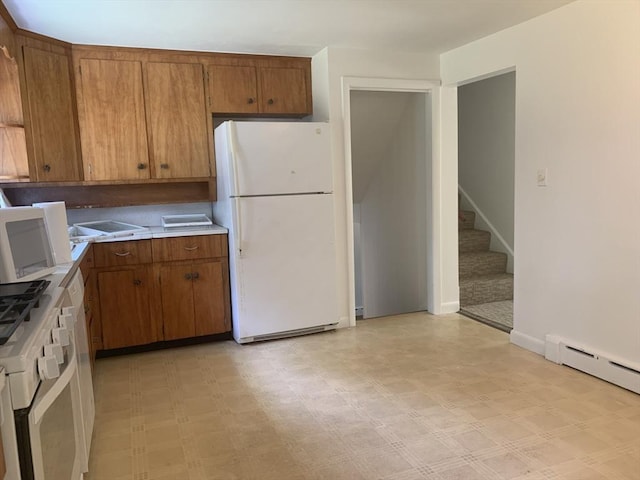 kitchen with light floors, a baseboard radiator, brown cabinetry, white appliances, and light countertops