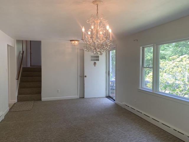 interior space with a baseboard heating unit, stairway, a healthy amount of sunlight, and a chandelier