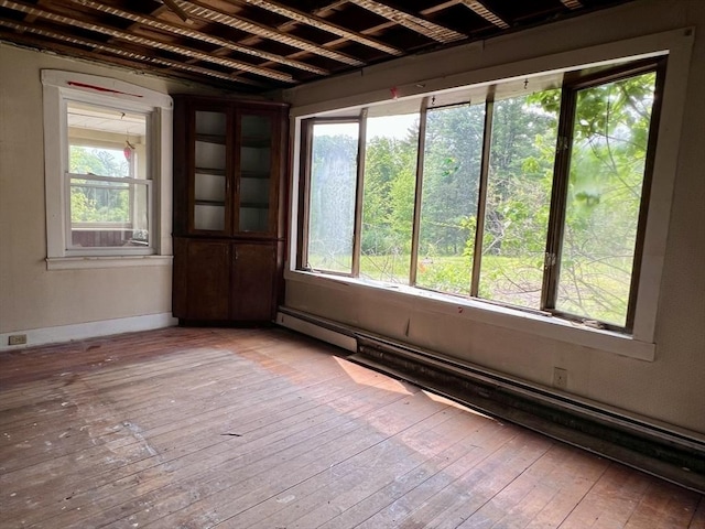 38 Clark St, Medway, MA 02053 - unfurnished room with light wood-style floors, baseboard heating, and baseboards
