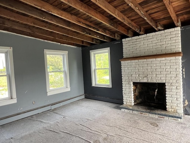 38 Clark St, Medway, MA 02053 - unfurnished living room with carpet floors, plenty of natural light, a brick fireplace, wooden ceiling with exposed beams, and baseboard heating